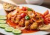 Resep Kakap Goreng Asam Manis yang Bikin Makan Nasi Nambah Terus Kakap Goreng Asam Manis renyah disajikan dengan saus manis pedas, sayuran segar, dan irisan tomat, menggugah selera.