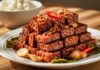 Resep Tahu Tempe Bacem: Resep Tradisional yang Bikin Kangen Rumah Tempeh manis pedas yang disajikan dengan irisan bawang dan cabai, menciptakan hidangan lezat khas Indonesia.
