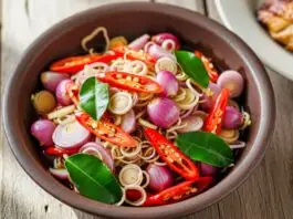 Resep Sambal Matah segar dengan rempah-rempah khas, seperti cabai merah, serai, dan daun jeruk, menambah aroma masakan Indonesia.